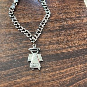 Sterling silver charm bracelet 7” with sterling silver angel.
